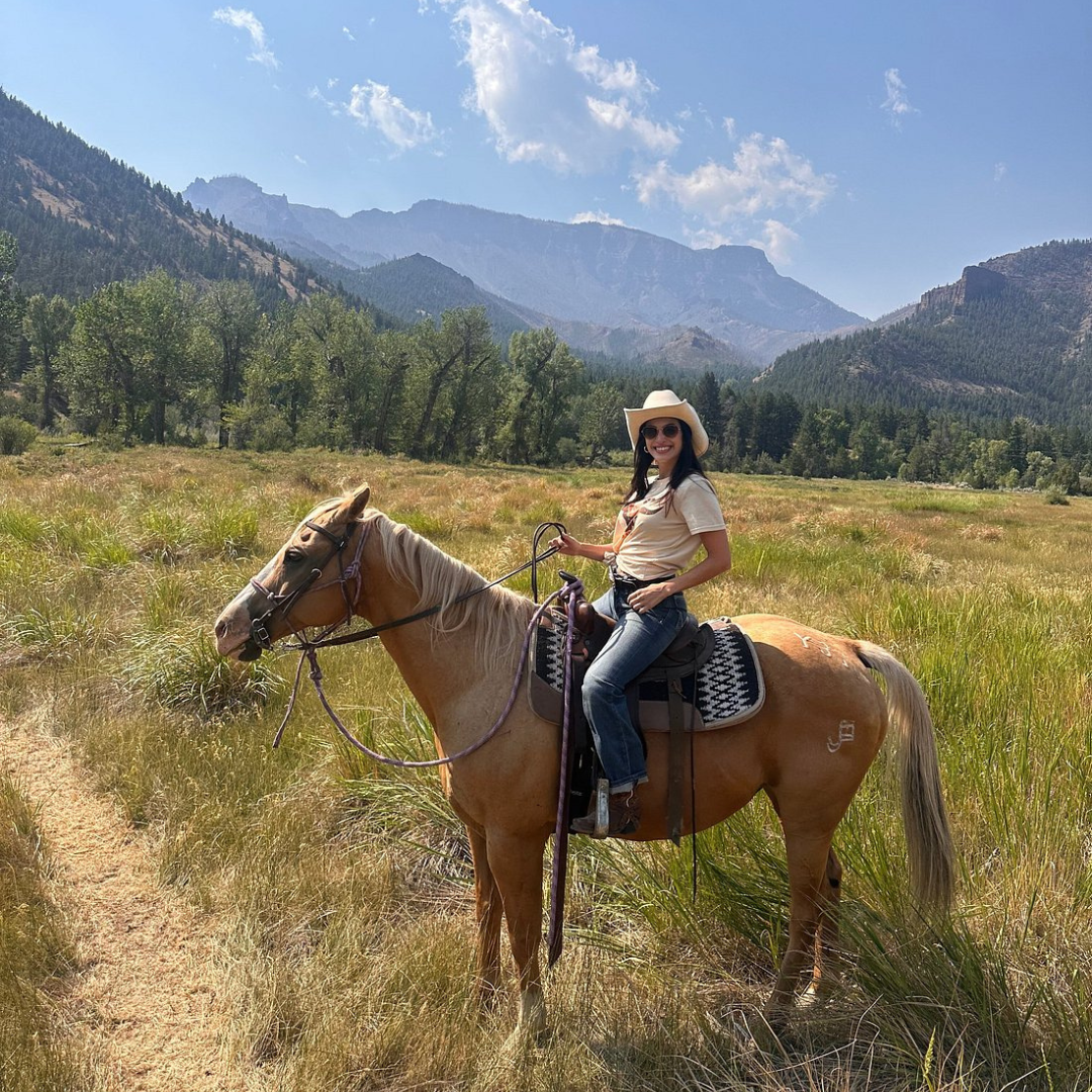 Martina M. On horse back at UXU Ranch